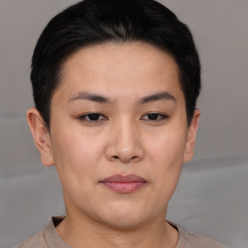 Joyful asian young-adult female with short  brown hair and brown eyes