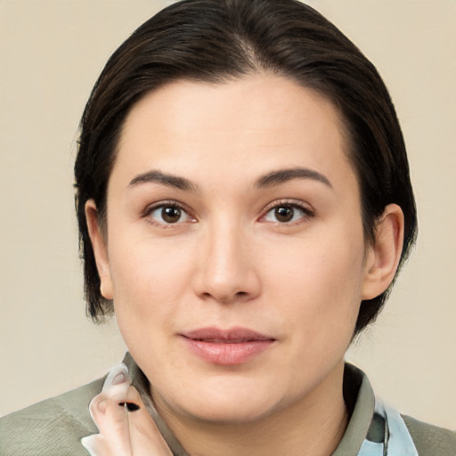 Joyful white young-adult female with medium  brown hair and brown eyes