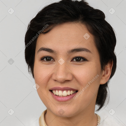 Joyful white young-adult female with medium  brown hair and brown eyes