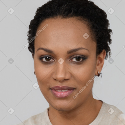 Joyful black young-adult female with short  black hair and brown eyes