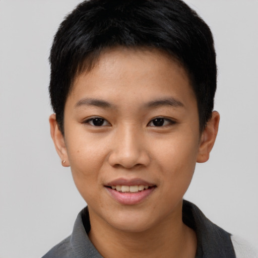 Joyful asian young-adult female with short  black hair and brown eyes