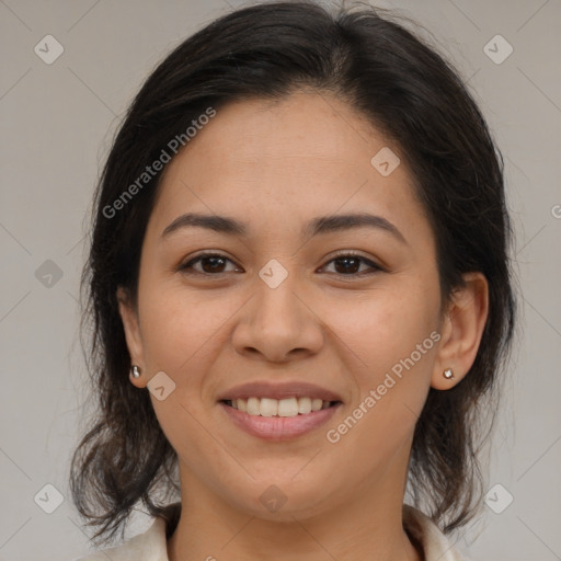 Joyful latino young-adult female with medium  brown hair and brown eyes