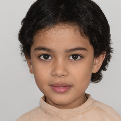 Joyful latino child female with short  brown hair and brown eyes