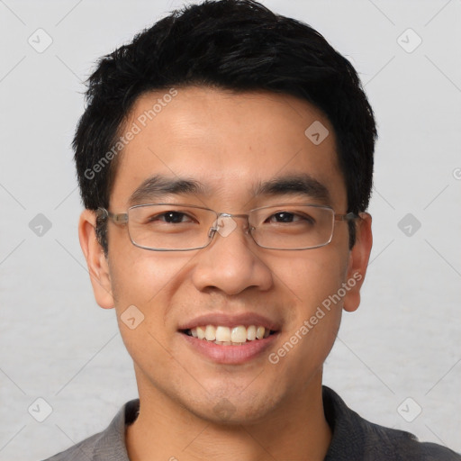 Joyful asian young-adult male with short  black hair and brown eyes