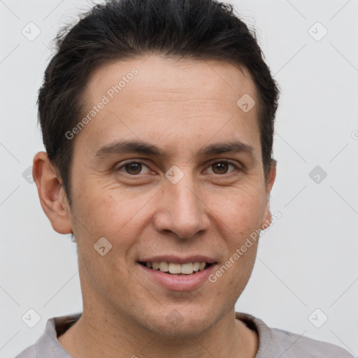 Joyful white adult male with short  brown hair and brown eyes