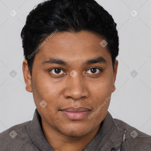 Joyful black young-adult male with short  black hair and brown eyes