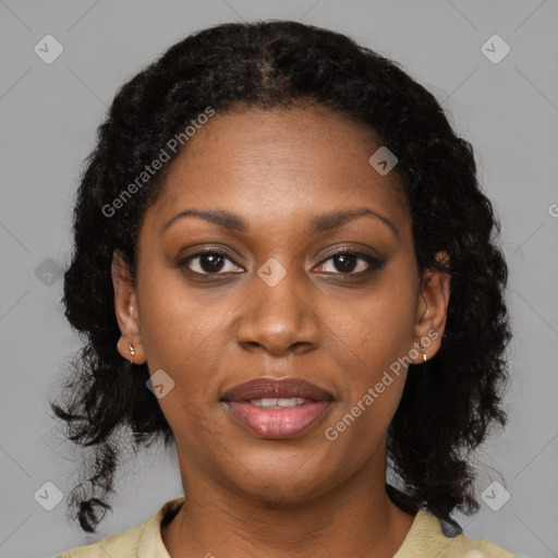 Joyful black young-adult female with medium  black hair and brown eyes