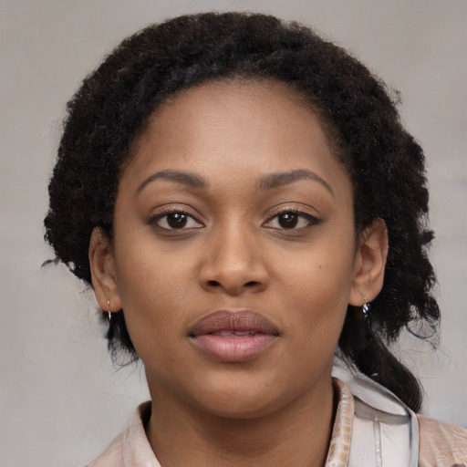 Neutral black young-adult female with short  brown hair and brown eyes