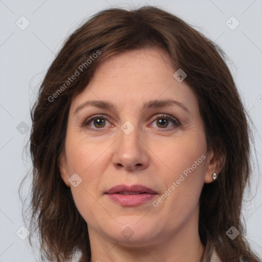 Joyful white adult female with medium  brown hair and brown eyes