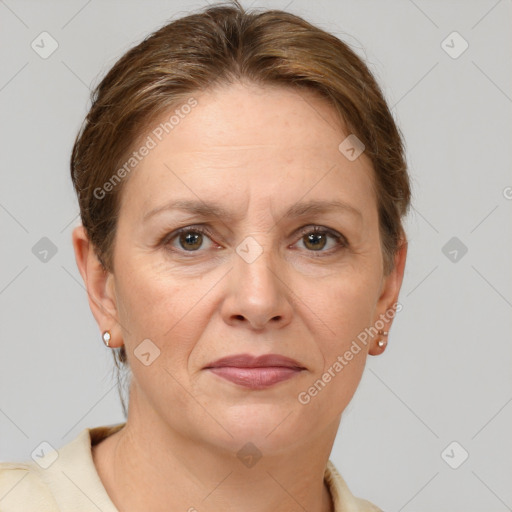 Joyful white adult female with short  brown hair and grey eyes