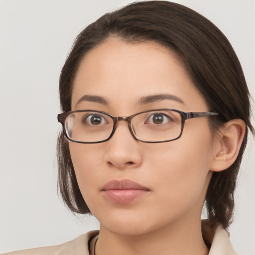 Neutral white young-adult female with medium  brown hair and brown eyes