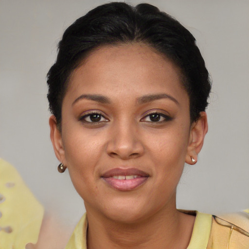 Joyful latino young-adult female with short  brown hair and brown eyes