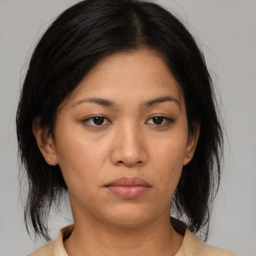 Neutral asian young-adult female with medium  brown hair and brown eyes