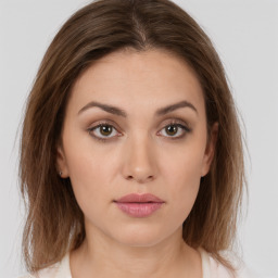 Neutral white young-adult female with medium  brown hair and brown eyes