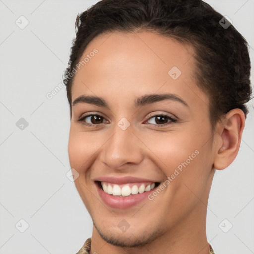 Joyful white young-adult female with short  brown hair and brown eyes