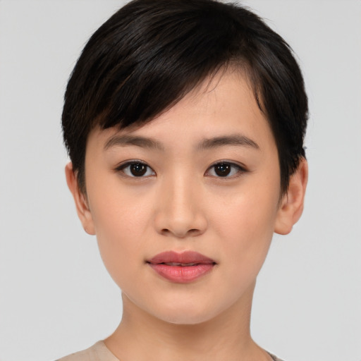 Joyful asian young-adult female with short  black hair and brown eyes