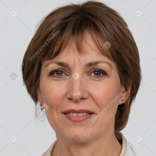 Joyful white adult female with medium  brown hair and grey eyes