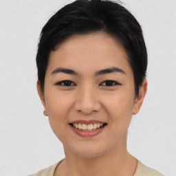 Joyful asian young-adult female with short  black hair and brown eyes