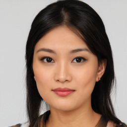 Joyful asian young-adult female with medium  black hair and brown eyes