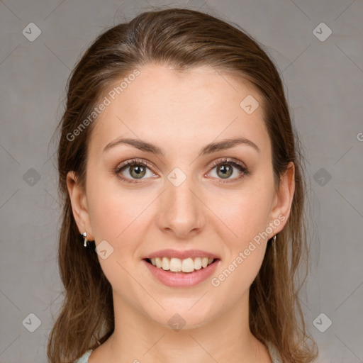 Joyful white young-adult female with medium  brown hair and green eyes