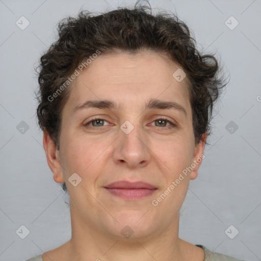 Joyful white adult female with short  brown hair and brown eyes