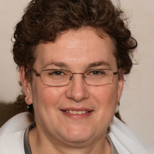 Joyful white adult male with medium  brown hair and brown eyes