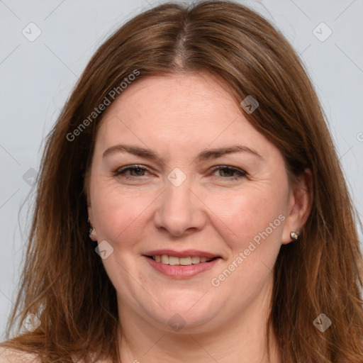 Joyful white adult female with long  brown hair and grey eyes