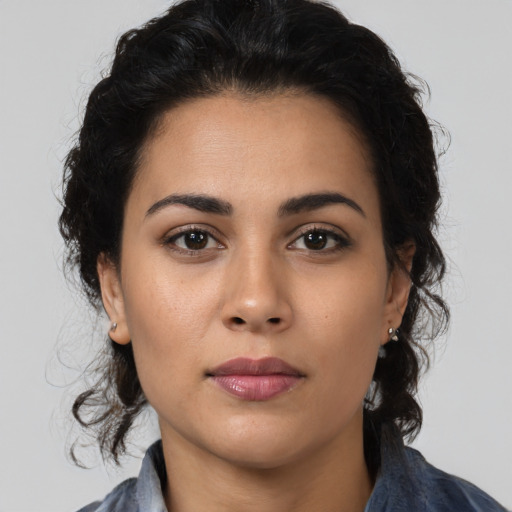 Neutral latino young-adult female with long  black hair and brown eyes