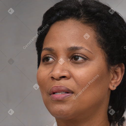 Joyful black adult female with short  black hair and brown eyes