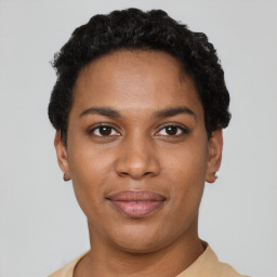 Joyful latino young-adult female with short  black hair and brown eyes
