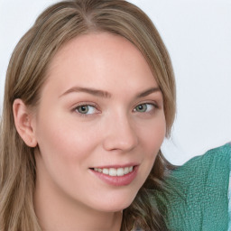 Joyful white young-adult female with long  brown hair and green eyes