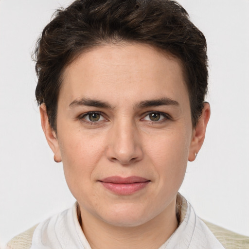 Joyful white young-adult female with short  brown hair and grey eyes