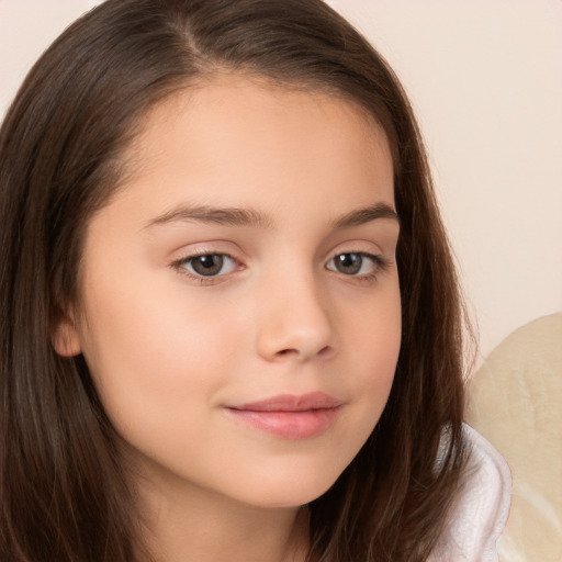 Joyful white child female with long  brown hair and brown eyes