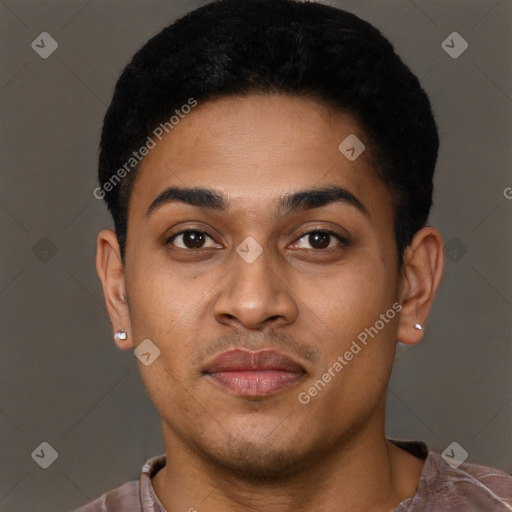 Joyful black young-adult male with short  brown hair and brown eyes