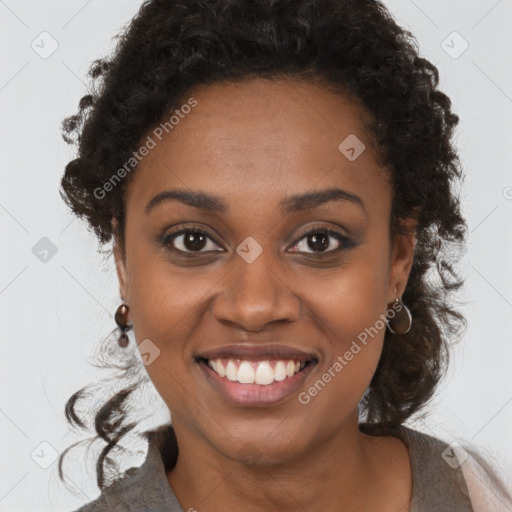 Joyful black young-adult female with long  brown hair and brown eyes