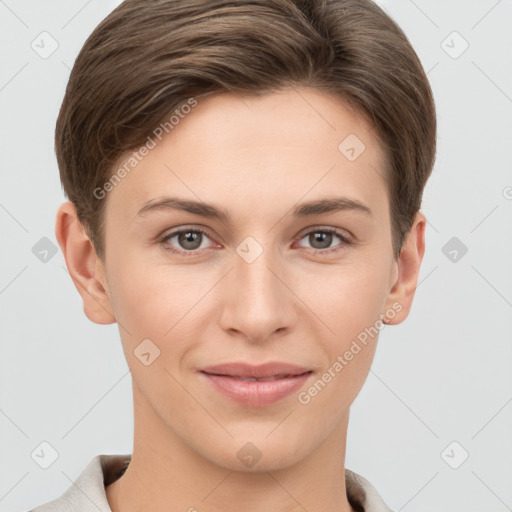 Joyful white young-adult female with short  brown hair and grey eyes