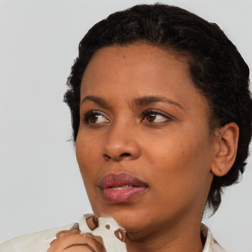 Neutral black young-adult female with short  black hair and brown eyes