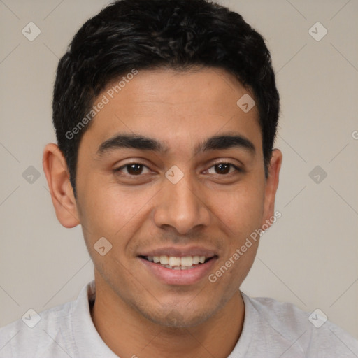 Joyful latino young-adult male with short  brown hair and brown eyes