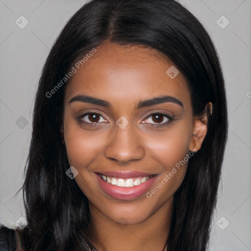 Joyful black young-adult female with long  brown hair and brown eyes