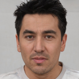 Neutral white adult male with short  black hair and brown eyes