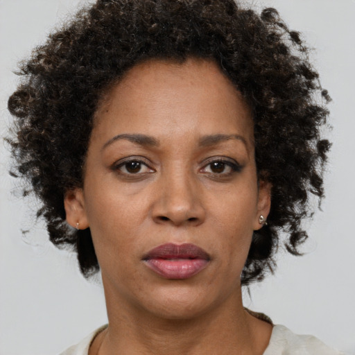 Neutral black adult female with short  brown hair and brown eyes