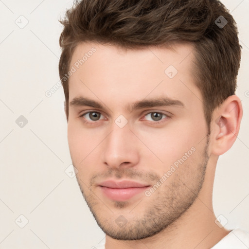 Neutral white young-adult male with short  brown hair and brown eyes