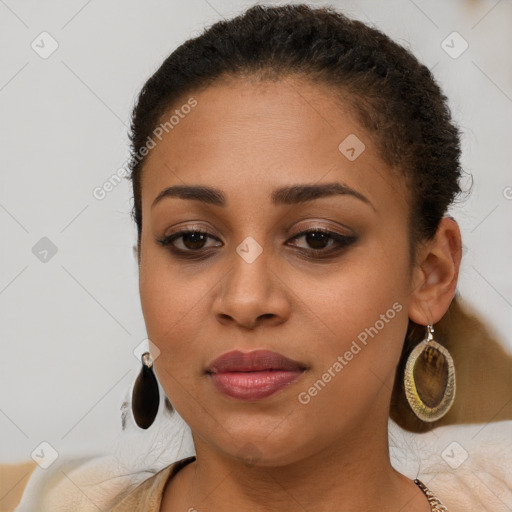 Joyful latino young-adult female with long  brown hair and brown eyes