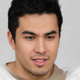 Joyful latino young-adult male with short  brown hair and brown eyes