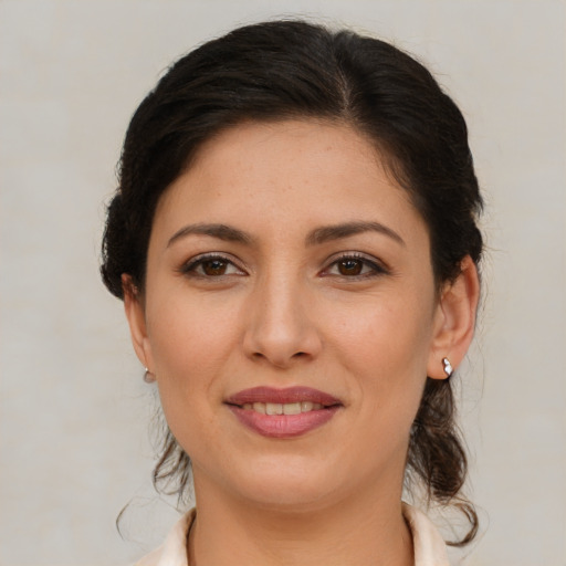 Joyful white young-adult female with medium  brown hair and brown eyes