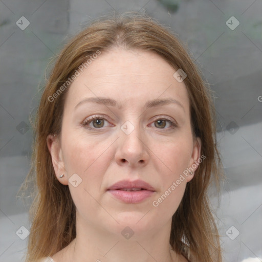 Joyful white adult female with medium  brown hair and grey eyes