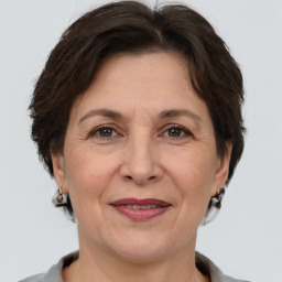 Joyful white adult female with short  brown hair and grey eyes