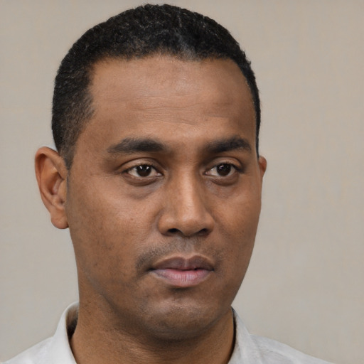 Neutral black young-adult male with short  black hair and brown eyes