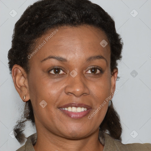 Joyful black adult female with short  brown hair and brown eyes