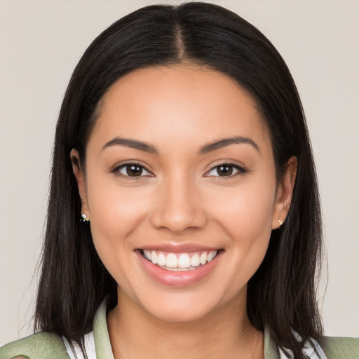 Joyful latino young-adult female with medium  black hair and brown eyes